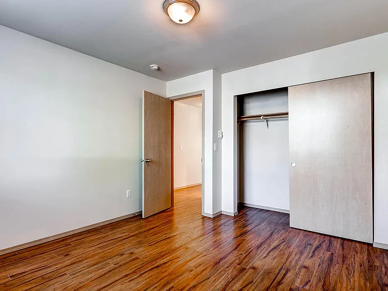 A Standard Bedroom with a Closet at The Regency Apartments