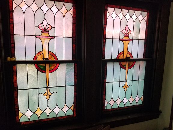 between 1st and 2nd floors stained glass on stairway