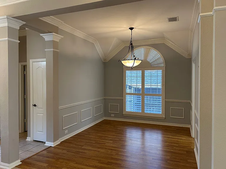 Another view of the formal dining room just off the entryway with crown molding.