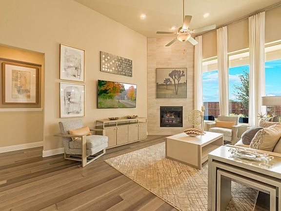 The comfortable and welcoming family room enjoys backyard views and patio access, plus it has a fire