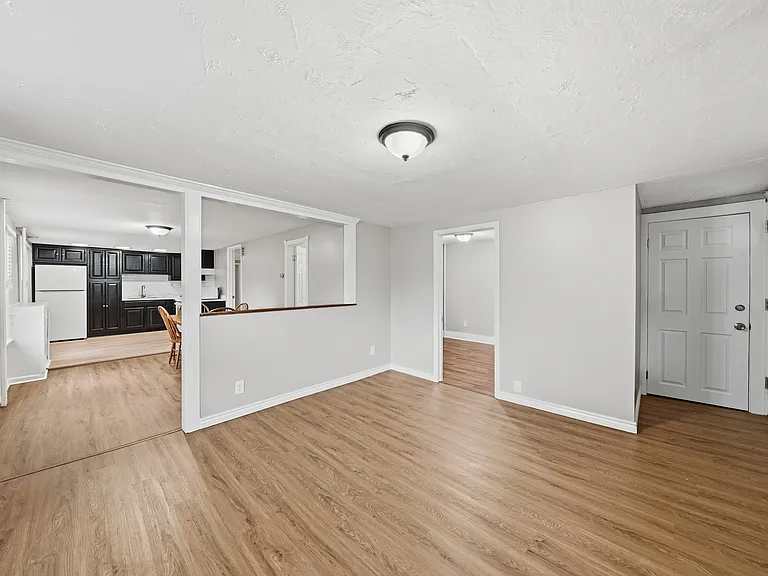Living Room with View of Front Bedroom and Dining Room