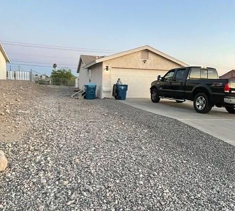 over 150 foot side yard from front gravel to the back backyard fence