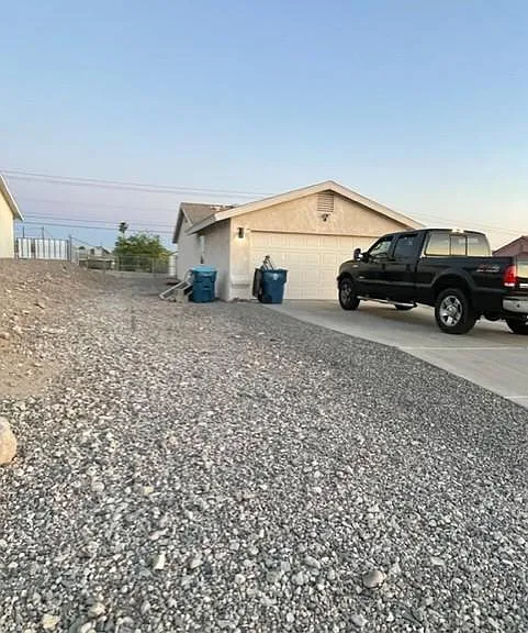 over 150 foot side yard from front gravel to the back backyard fence