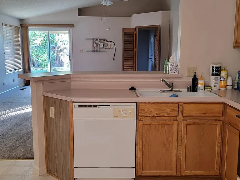 Kitchen overlooking living room, all electric appliances