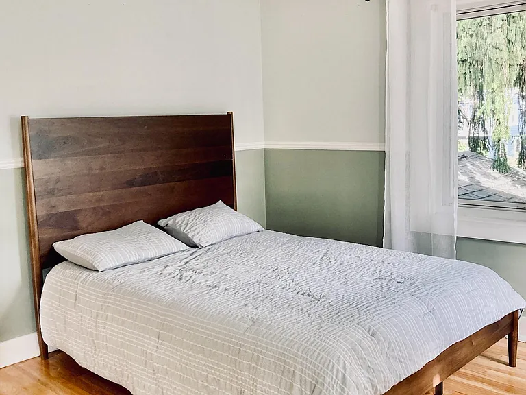 View of the second-floor bedroom, from the large, deep corner closet.