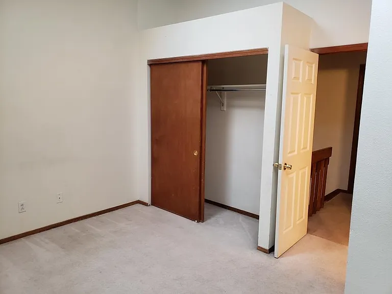 Spacious closet in bedroom1. En-suite bath is behind wall on right