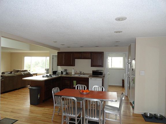 kitchen. showing laundry to the right and fam. rm. to left