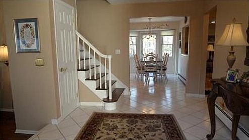 View toward kitchen showing the spaciousness and brightness of the entry