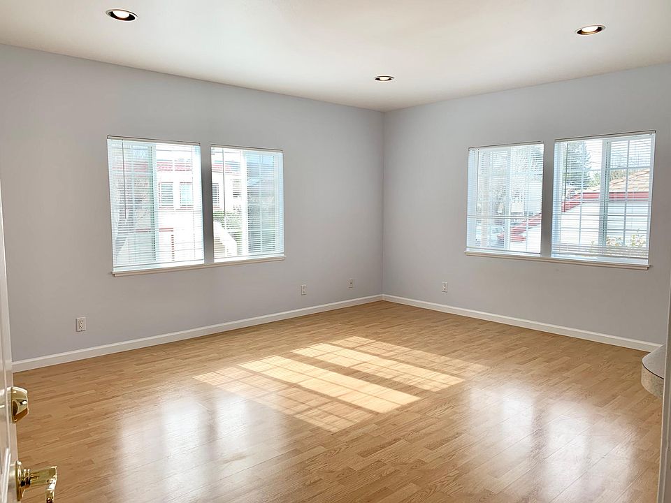 Unit #1 light and bright living room opens up into the kitchen