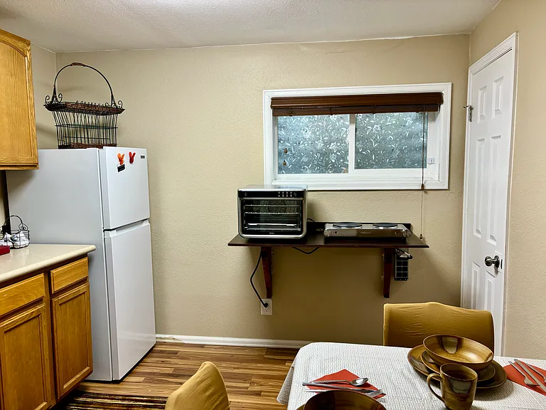 Kitchenette: good size, well-lit, well equipped: Ninja Foodi XL Pro-Air Oven, 2 burners, Microwave, Fridge/Freezer, Keurig, disposal, crockpot, toaster, skillet, pan, etc. Window with film design & custom blinds