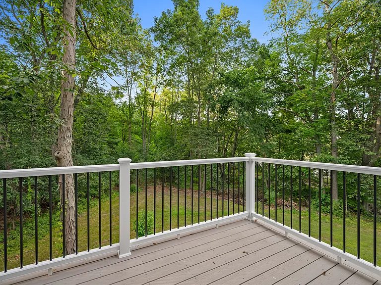rear deck view of 2 acres of property