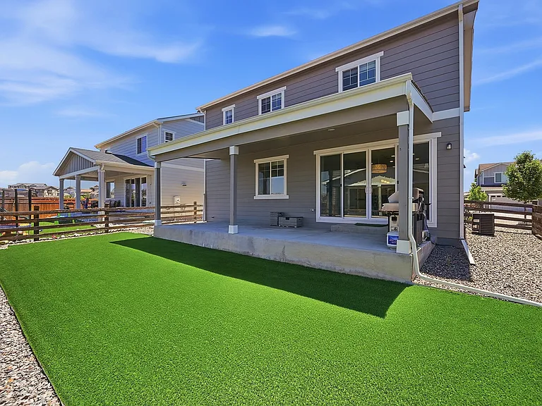 Fenced turf backyard