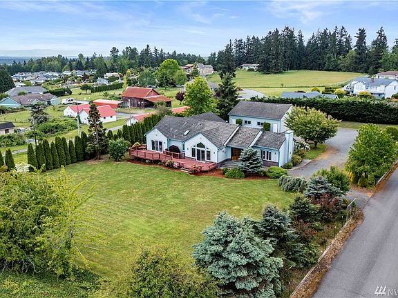 A lovely custom rambler ~ 1+ acre lot with room to roam ~ beautiful mountain views ~ tons of parking & a dream shop for the car enthusiast! This fantastic property will checks all the boxes
