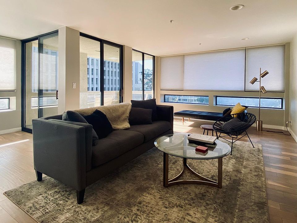 Living area with large balcony offering spectacular views of DTLA