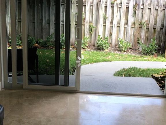 Sliding glass door to gate and lake