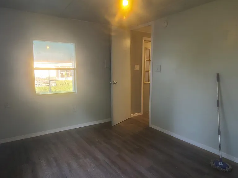 Back bedroom door to garage or mancave behind.