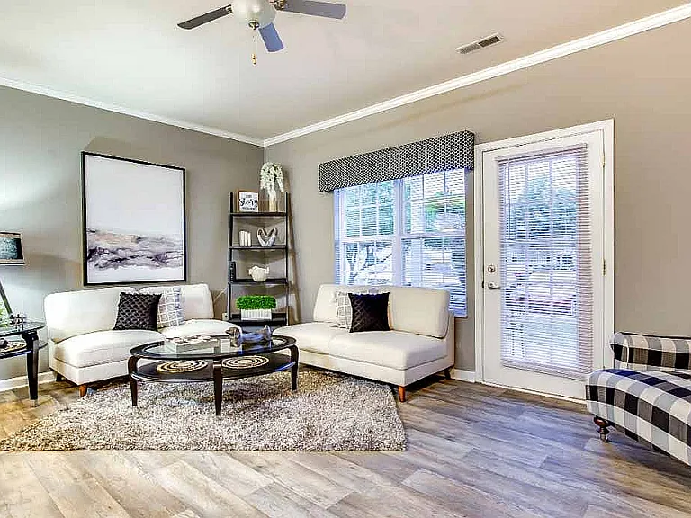 Large living rooms with natural light are among the apartment features.