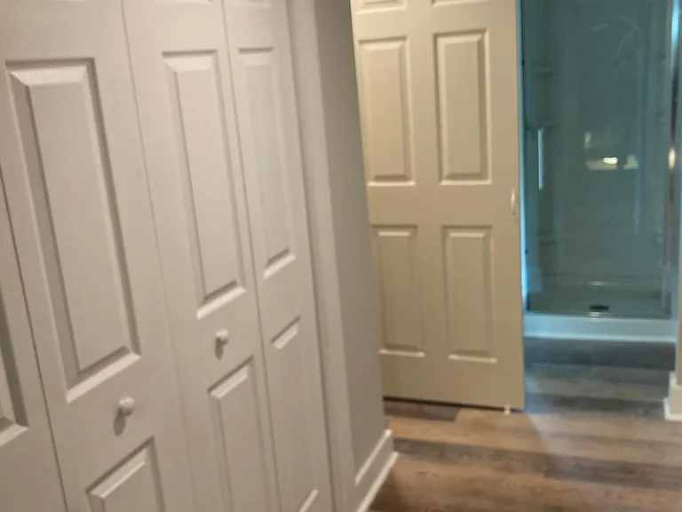 Attic bedroom #2...hallway, double closet leading to bathroom