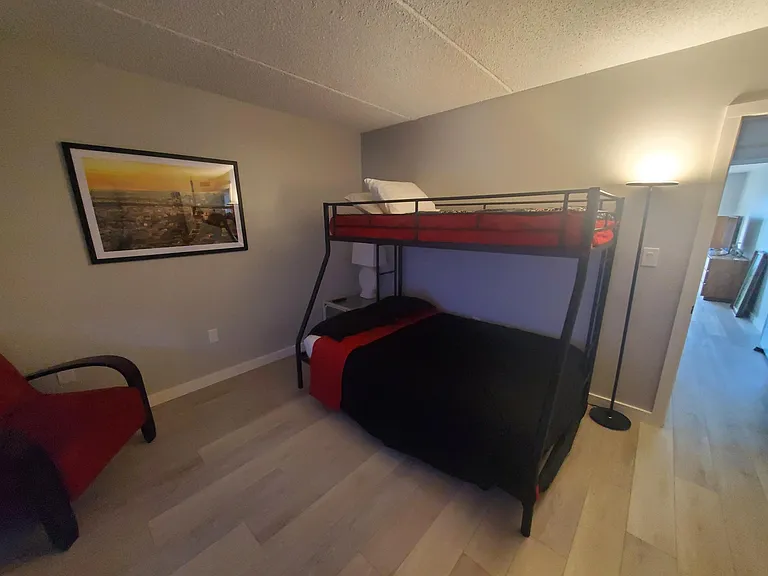2nd Bedroom full bed with twin up top and twin trundle. 65 inch smart TV and 2 large closets