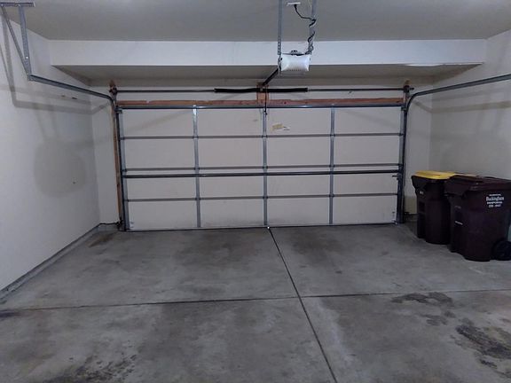 2 car garage with cabinet storage in front.
