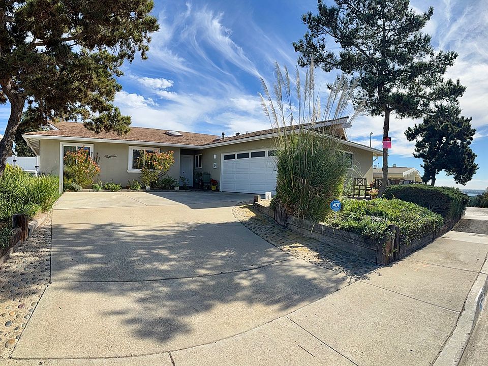 Lovely curb appeal with ample driveway and 2 car garage