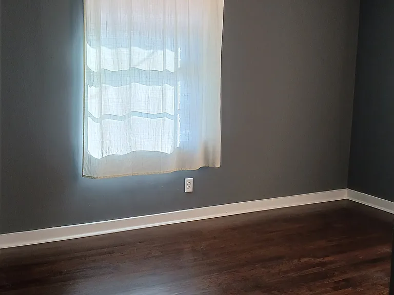 Hardwood floors and remote-controlled ceiling fans in all bedrooms.
