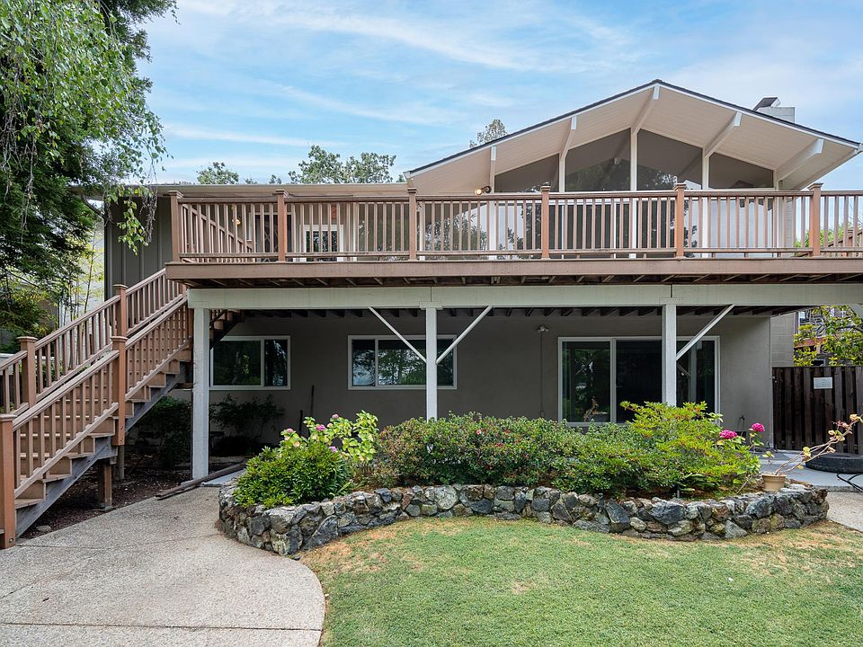 This stunning home comes with a deck from which to enjoy the treetop view of Menlo Park. This picture is taken from the vantage point of the back yard. (01)
