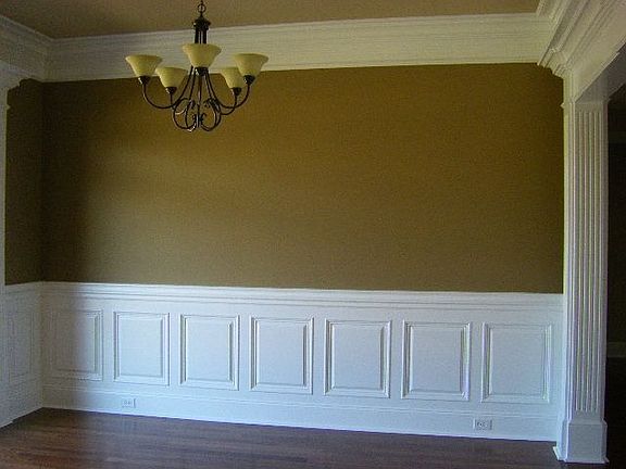 Dinging room with wood floors and moldings