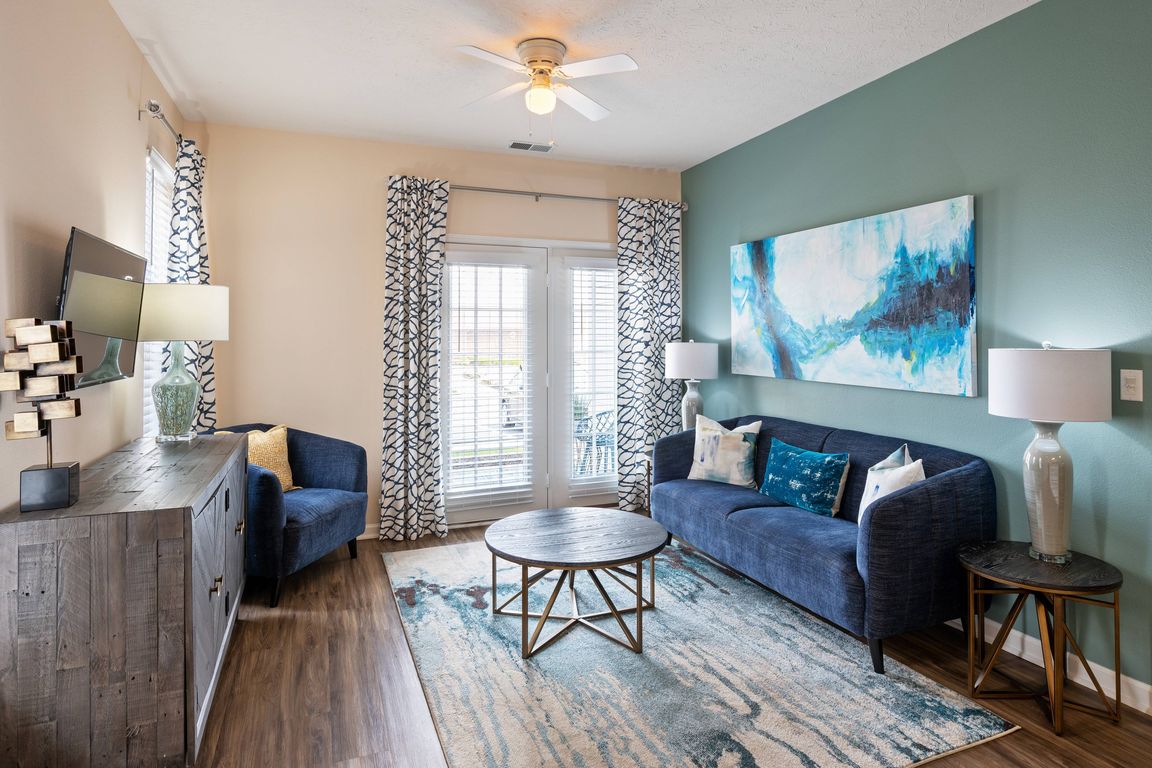 Spacious Living Room with Hardwood-Style Flooring