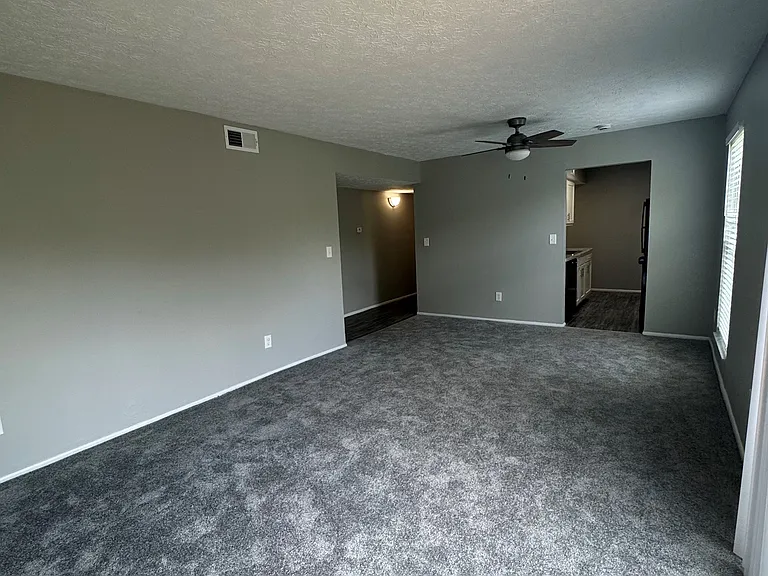 Living Room/Dining Room with new flooring/paint