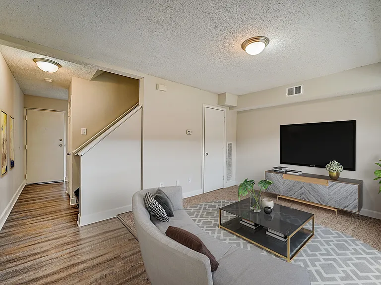 Recently Renovated Townhouse Style Apartments featuring New gray carpet, Neutral paint scheme, Premium hardwood-style flooring, Neutral paint scheme, Upgraded light fixtures, New cabinets, Matching stainless steel appliances, Washer/Dryer, Air conditionin