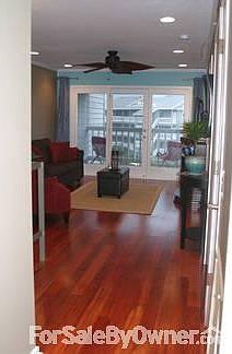 Look at the Brazilian Cherry Floor!
						:
						Looking into living room from hallway near entrance. huge windows.