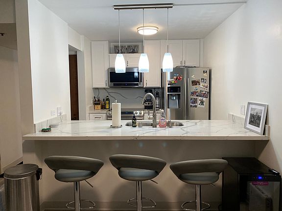 Kitchen area with bar seating.