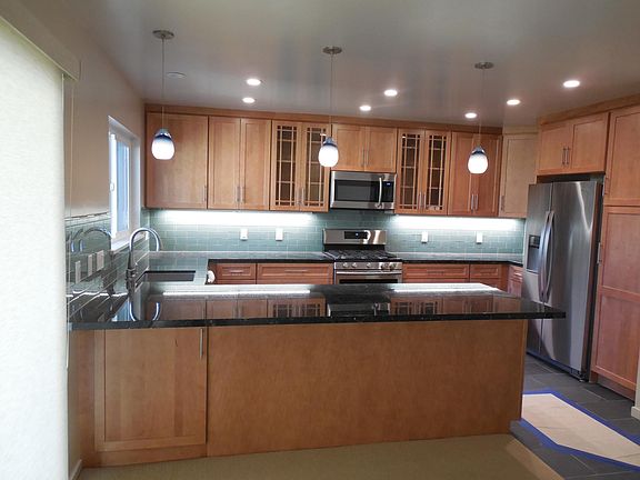 LED lighting over expansive eating counter.