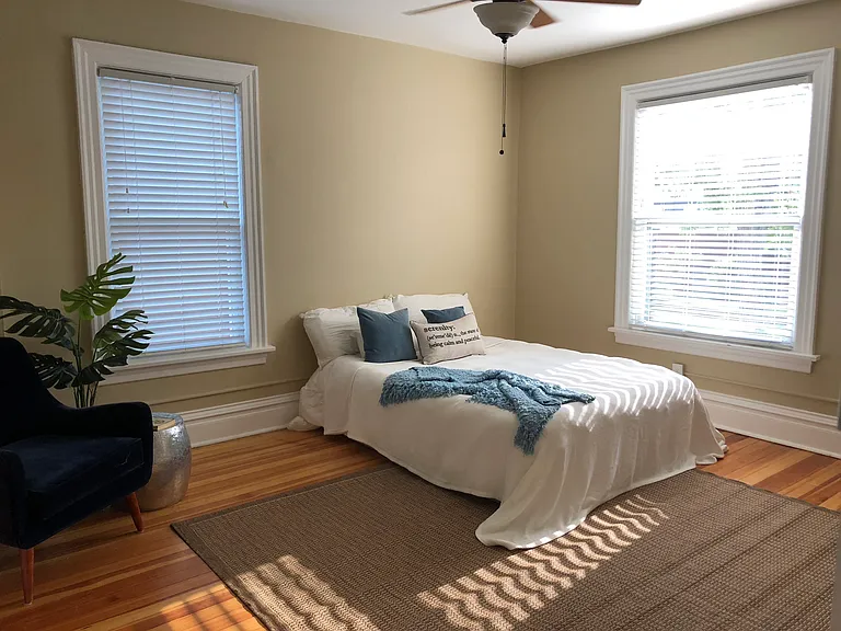 Primary bedroom with large walk in closet (updated with new ceiling fan and neutral paint colors)