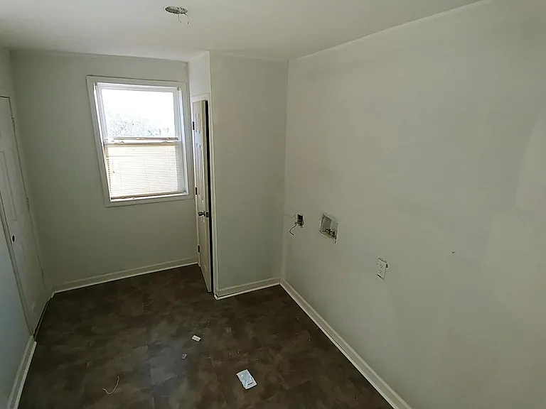 A room dedicated to your washer and dryer. new flooring, new hot water tank, ready for your appliances