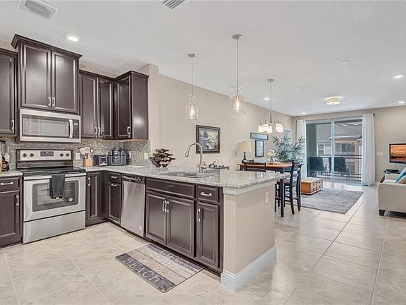 5th image of 7573 Laureate Blvd #1408