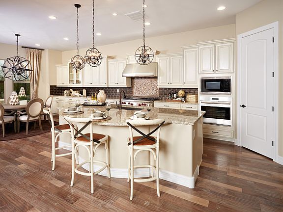 Included in the kitchen comes a chef s kitchen layout with built-in appliances and recessed maple ca