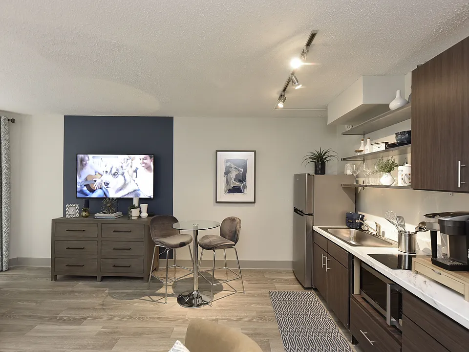 Kitchen with quartz counters, modern cabinetry, and stainless appliances