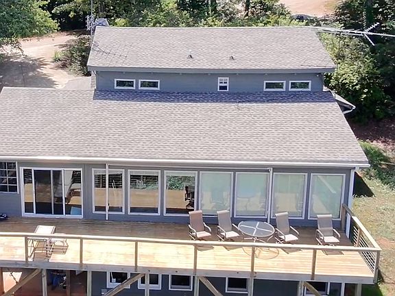The back deck has a retractable canopy so you can enjoy the mountains