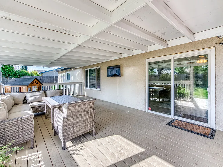 This slider off the living room leads out to the covered patio with lots of room to entertain al fresco!