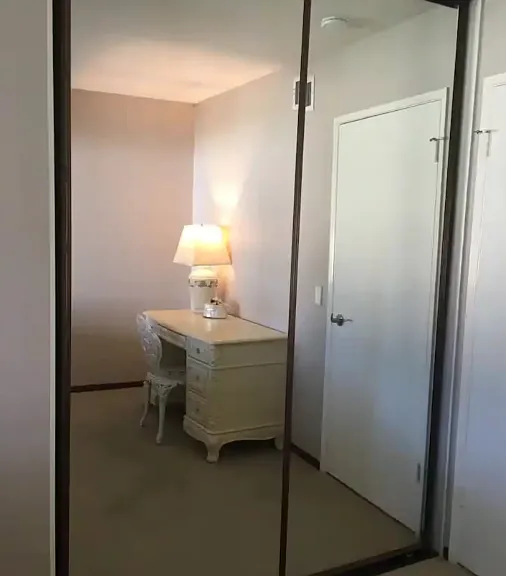 One of the bedrooms has this big sliding door mirrors for the closets.