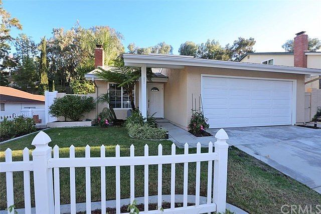 Lovely home with new driveway and walkway in a quiet, family friendly neighborhood.