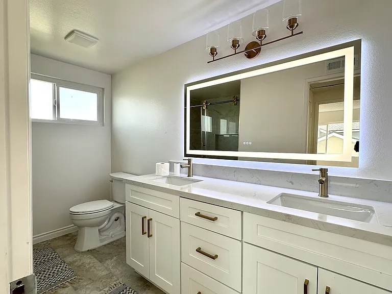 Hallway Bathroom on second floor
Fully renovated with double sink vanity, plenty of storage and led mirror