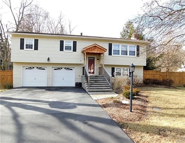 Large driveway, 2 car garage and beautiful stone steps leading to your front door.