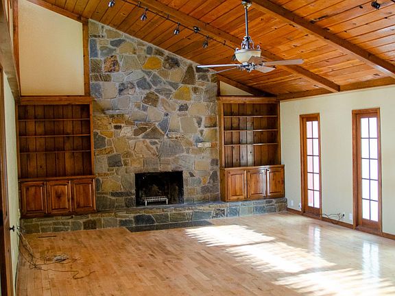 Wood burning fire place with built in cabinetry. Skylights pour in natural light.