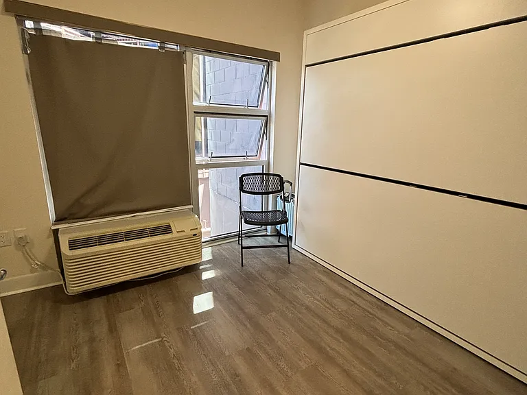 Versatile third bedroom with a built-in European-style twin bunk bed