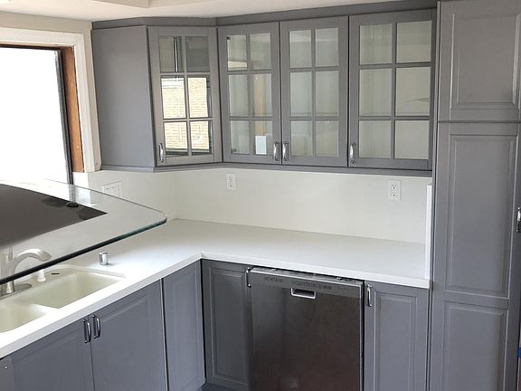 New Kitchen with new stove being unwrapped