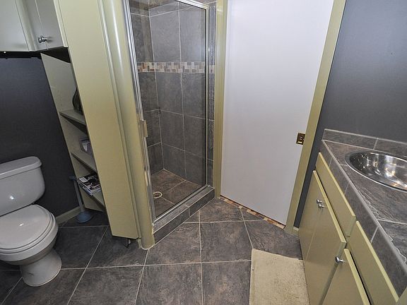 The second full bath is beautifully tiled.