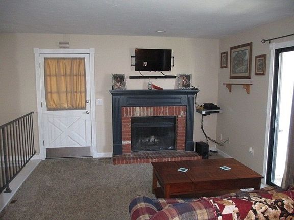 Living room wood burning fireplace.